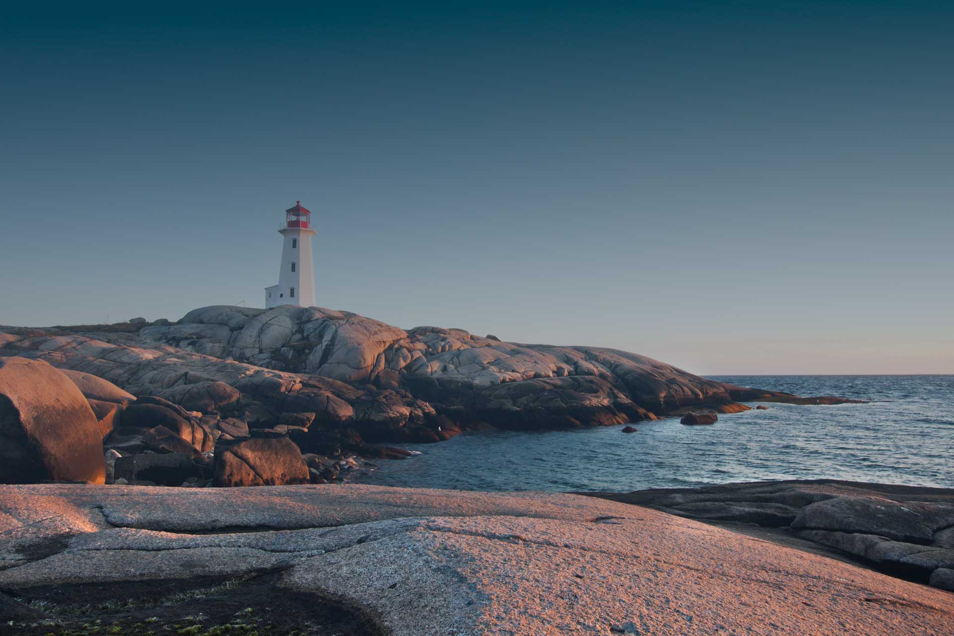Photograph at sunset of Peggy's Cove lighthouse