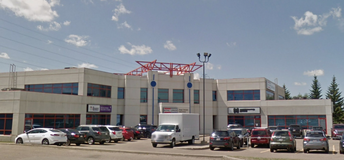 Large, multi-unit, single storey mall with parking and direct access to street. Located at 9919-9961 170th Street North-West, Edmonton, Alberta. 