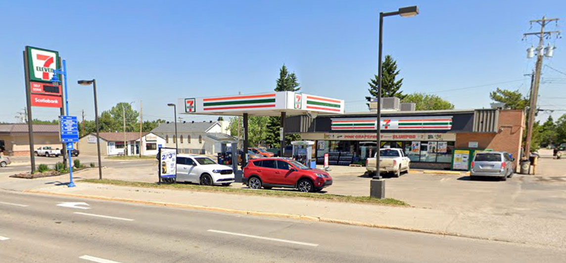 Single story gas station with convenience store and parking. Located at 4913 50th Avenue, Drayton Valley, Alberta. 