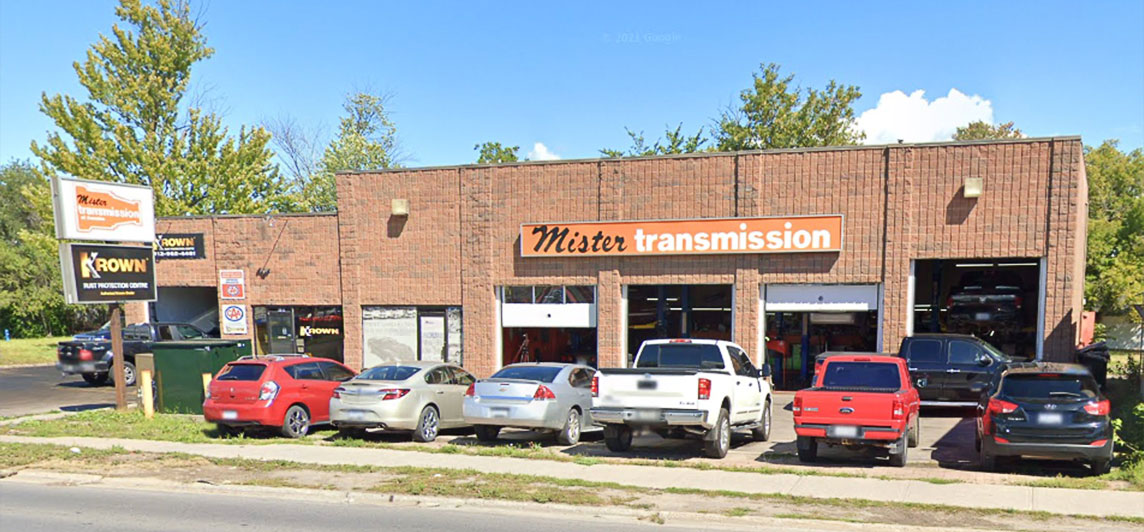 Auto body and mechanic storefront with four large garages and parking. Located at 115-117 Front Street, Belleville, Ontario.