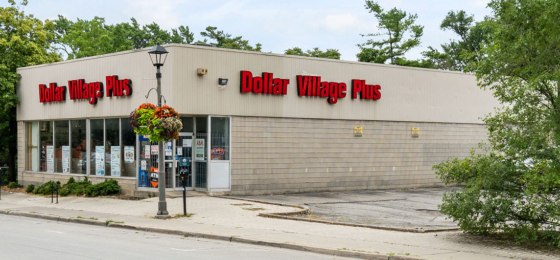 Storefront with dollar store signage and parking lot located at 416 Kerr Street, Oakville, Ontario.