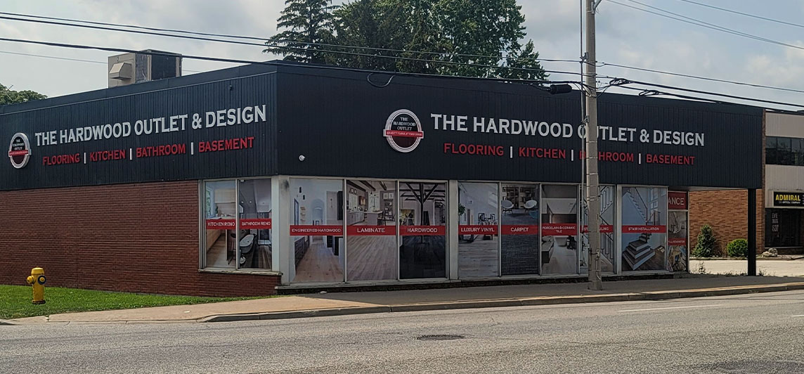 Large standalone storefront with signage on walls facing towards street. Located at 5189 Tecumseh Road East, Windsor, Ontario.