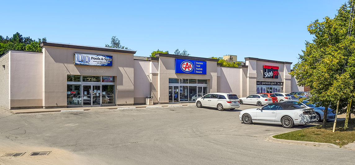 Strip mall styled building with three large storefronts located at 78 First Street, Orangeville, Ontario.
